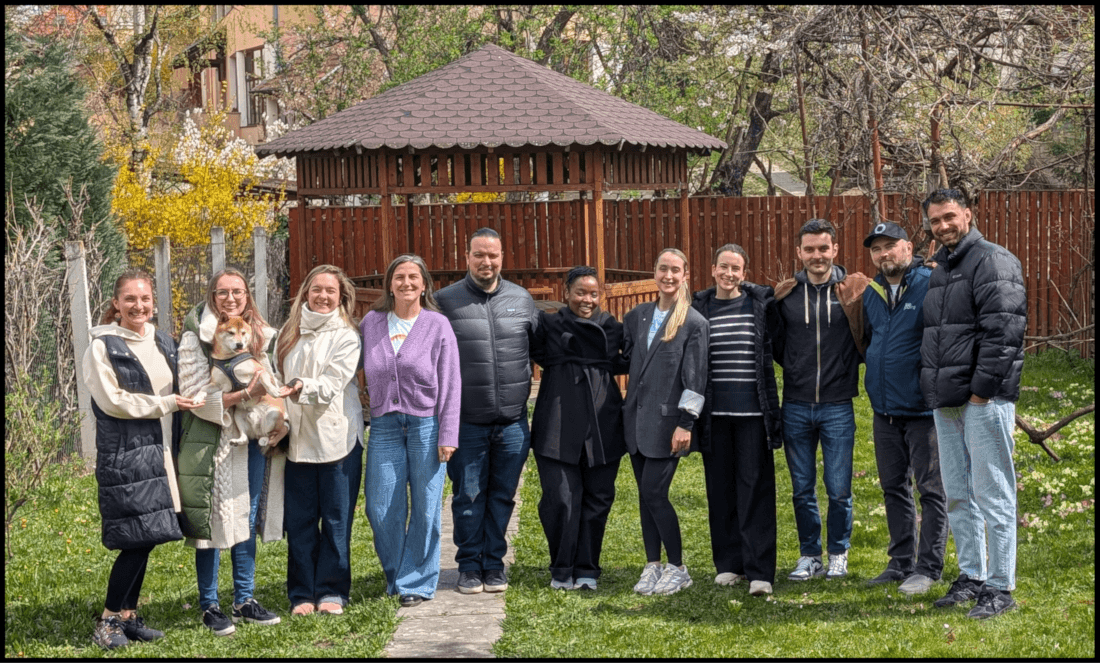 Group photo of in-person Web Monetization Work Week members in the office garden.